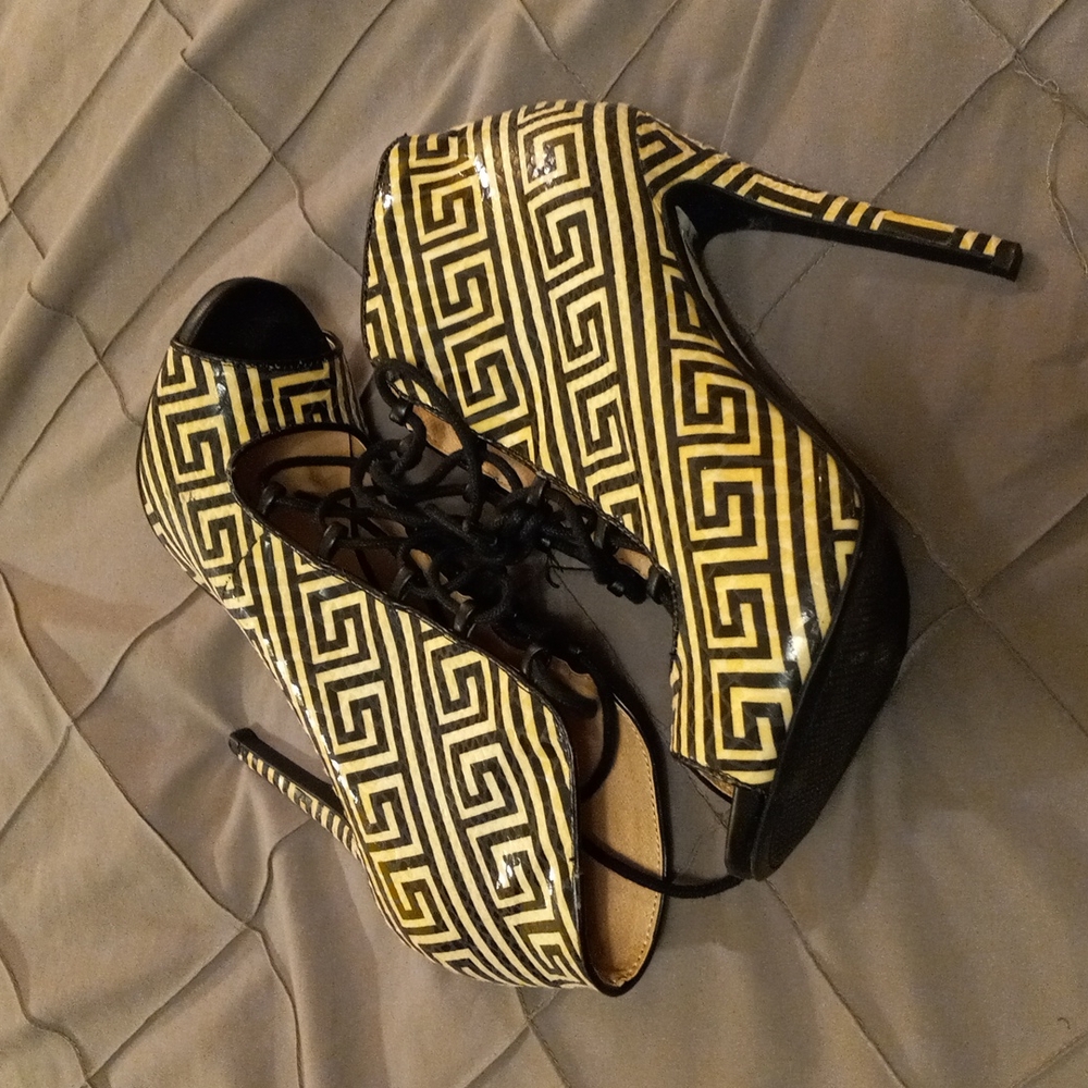 Black and white ankle tie up boots